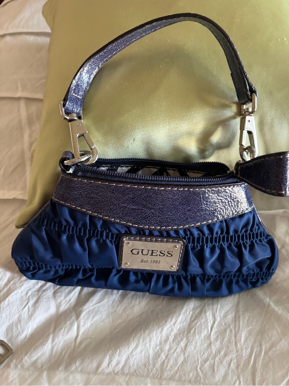 GUESS Navy Blue Mini Ruched Wristlet with pattern leather Metallic Trim